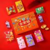 Inside view of Xu Fu Ji Chinese New Year gift box showing assorted snacks candy biscuits sachima jelly marshmallow and festive treats